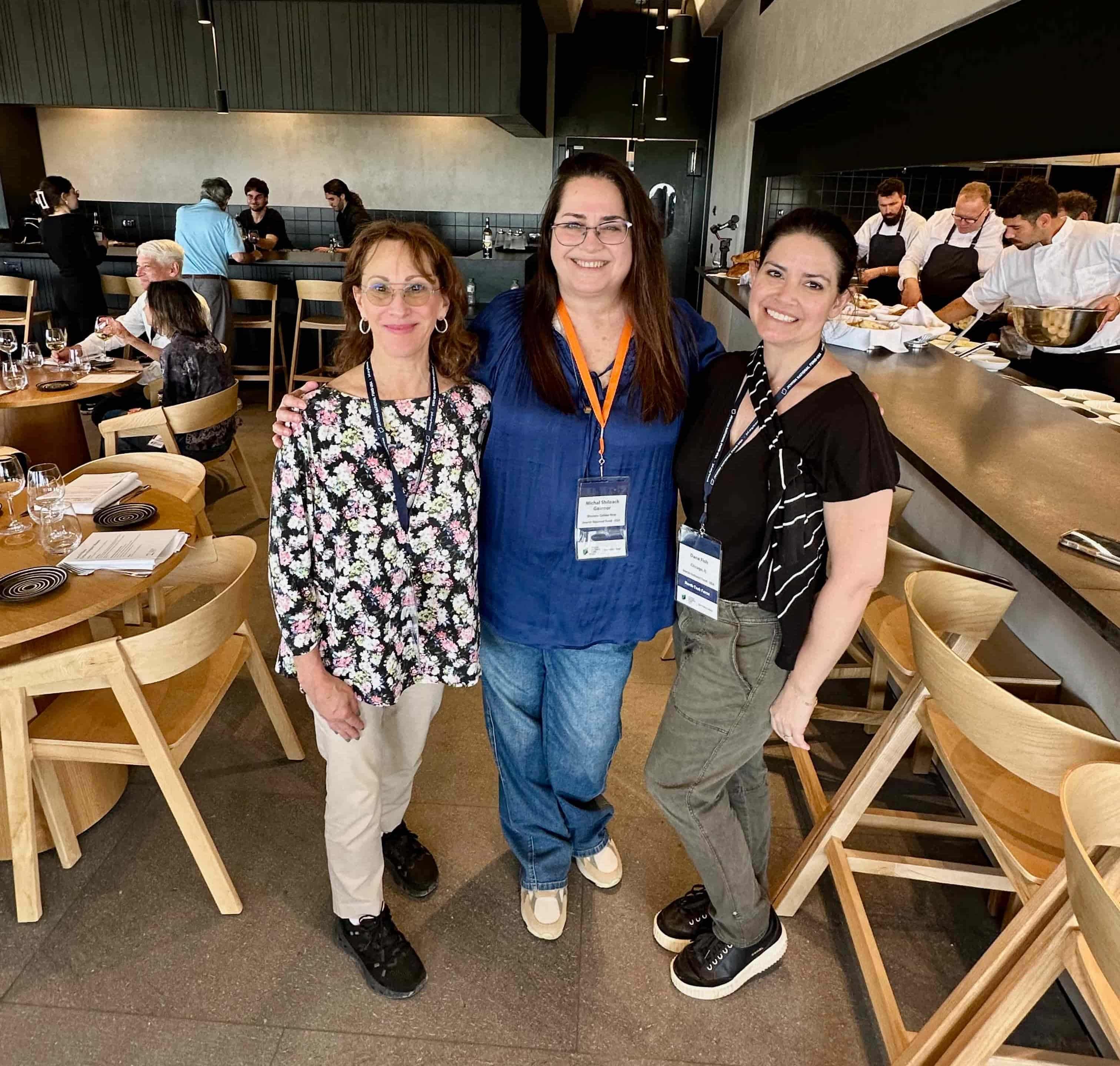 Amy Berko Iles, left, and Dana Fish, right, stand with Michal Shiloah Galnoor at the Galilee Culinary Institute by JNF