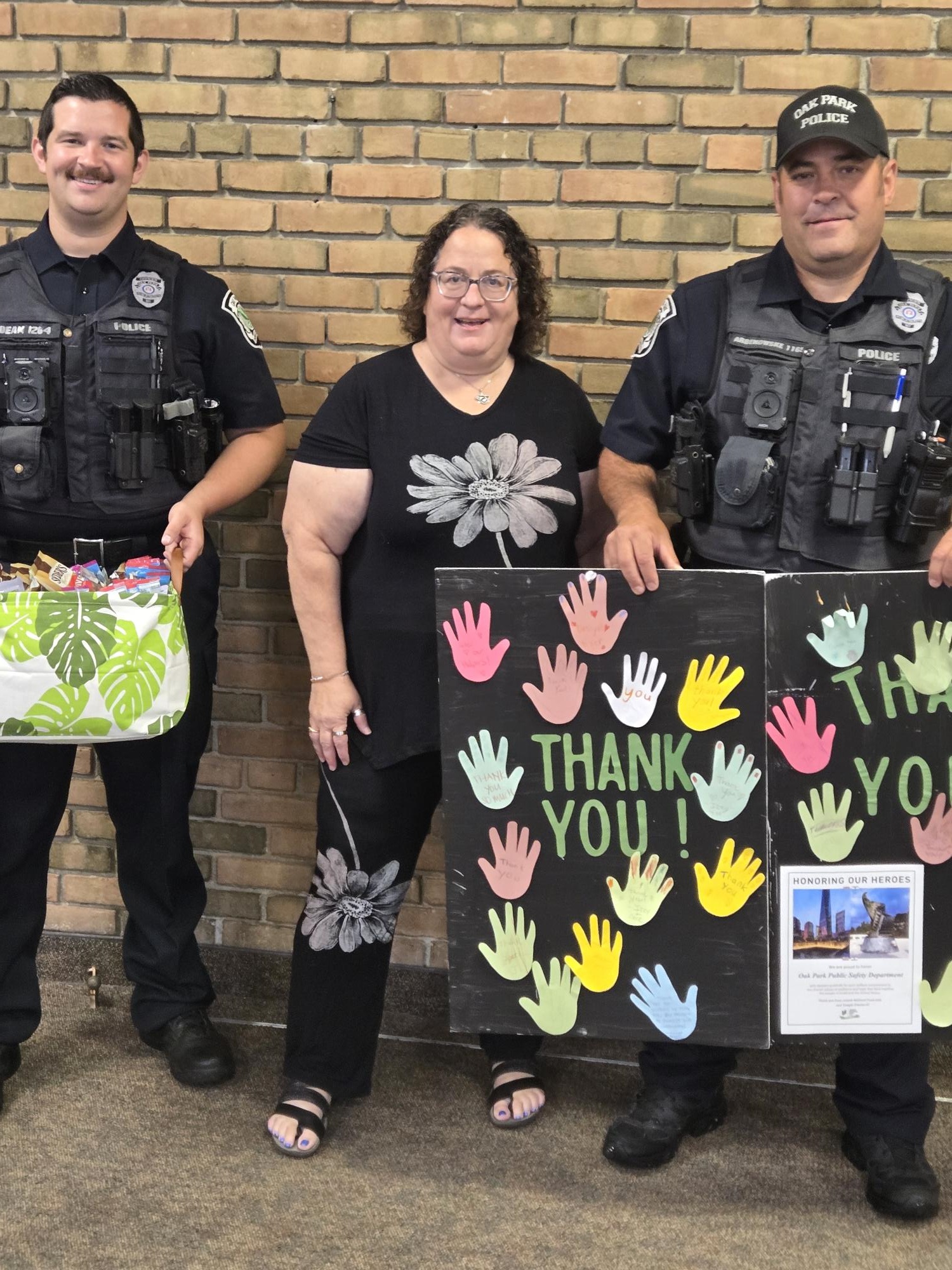 Gail Greenberg with Oak Park Public Safety Department Officers Dean and Arbenowske. Photo courtesy of Gail Greenberg. Gail Greenberg with Oak Park Public Safety Department Officers Dean and Arbenowske. Photo courtesy of Gail Greenberg.