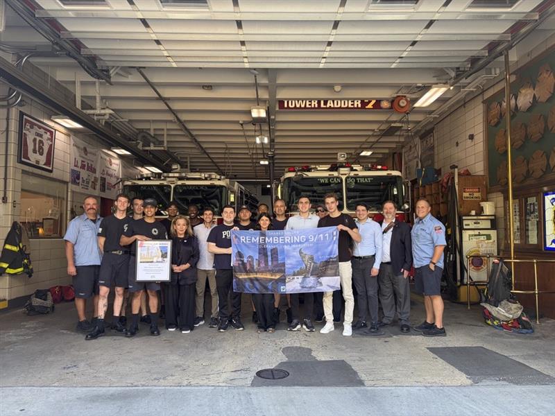 Jewish National Fund-USA Vice President, Ambassadors, Sheryl Buchholtz and Israel Program Admission Director Richard Abrams with FDNY Engine 16/Ladder 7 first responders and Hillel at Baruch College students