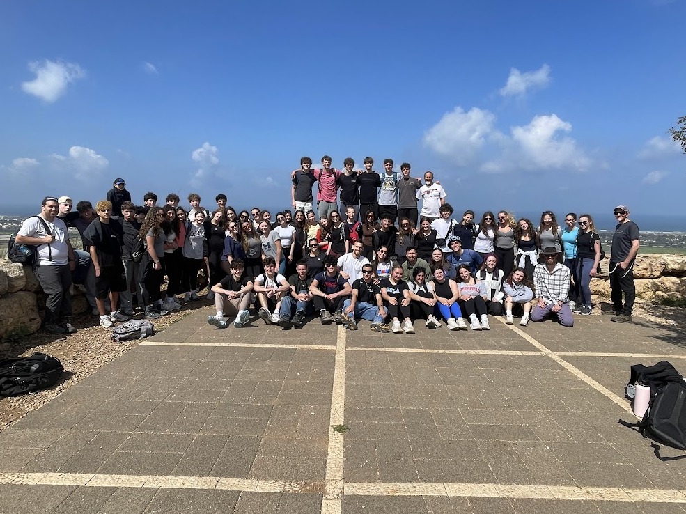 Muss students gather together at a scenic overlook during a Spring semester study abroad program in Israel.
