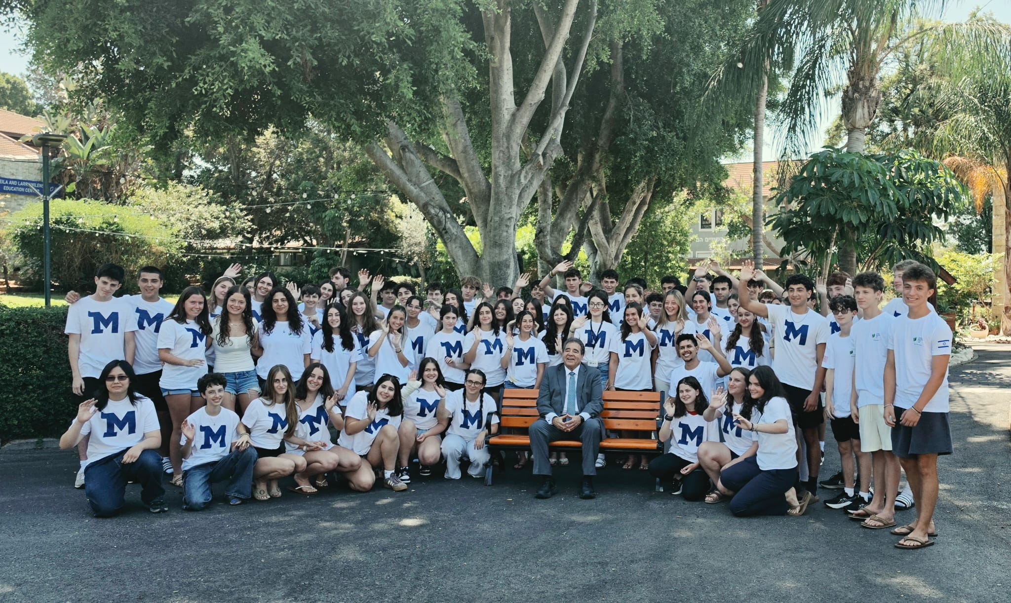 Muss High School Israel (Muss) students posing in t-shirts with the new Muss logo with Jewish National Fund-USA CEO Russell F. Robinson