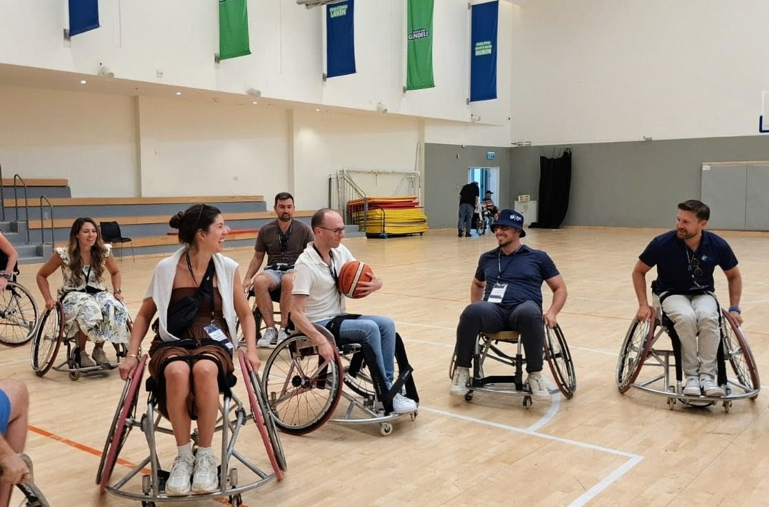 Participants playing wheelchair basketball at Adi Negev JLIM participants playing a wheelchair basketball game at Adi Negev
