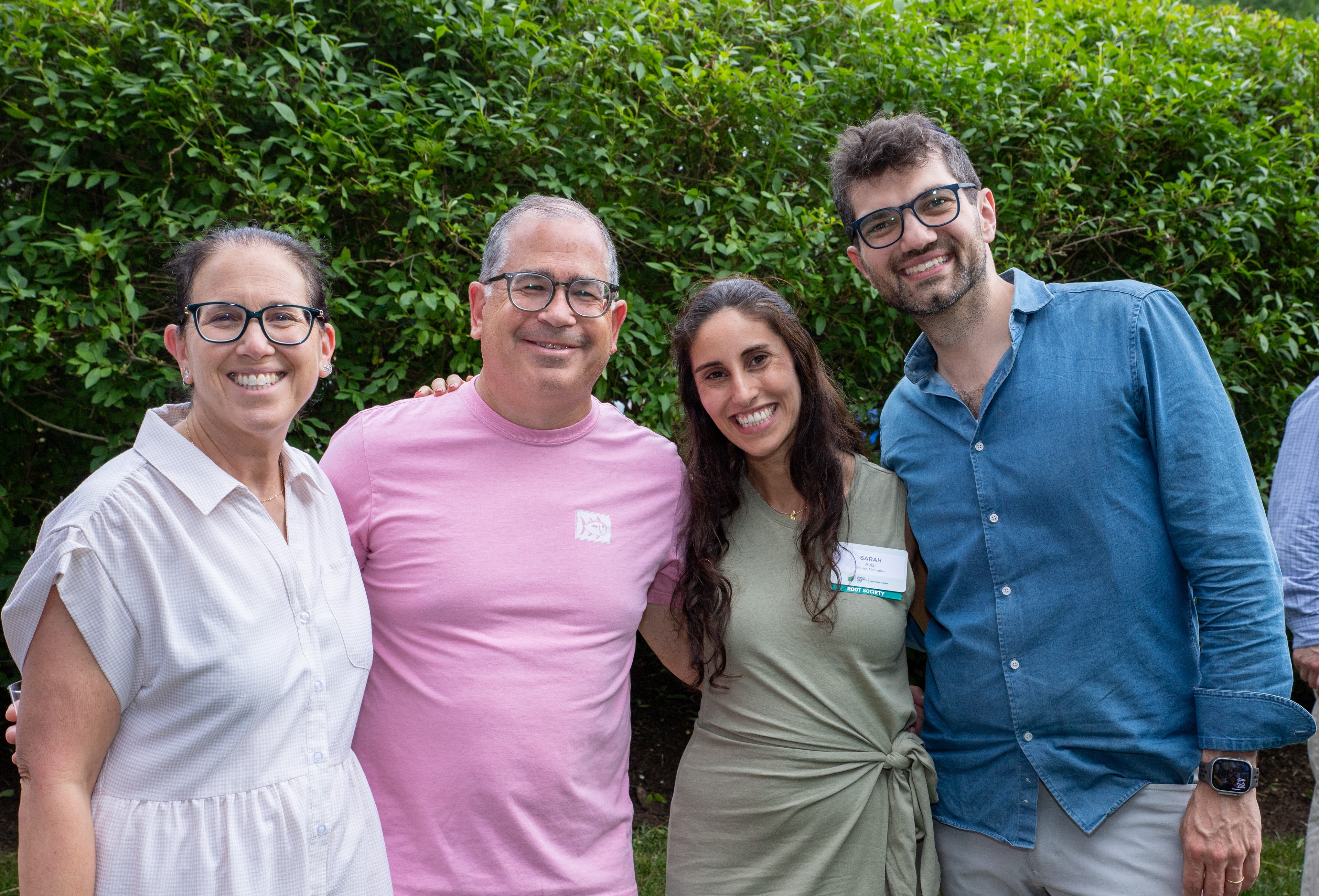 Four Jewish National Fund-USA supporters smile together outdoors at the Livingston Tzofim Friendship Caravan gathering.
