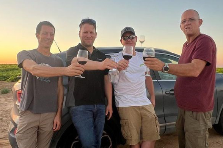 Men Holding Wine Glasses