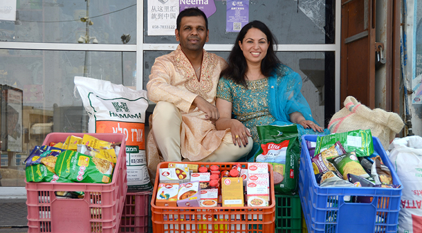 man and woman donating food