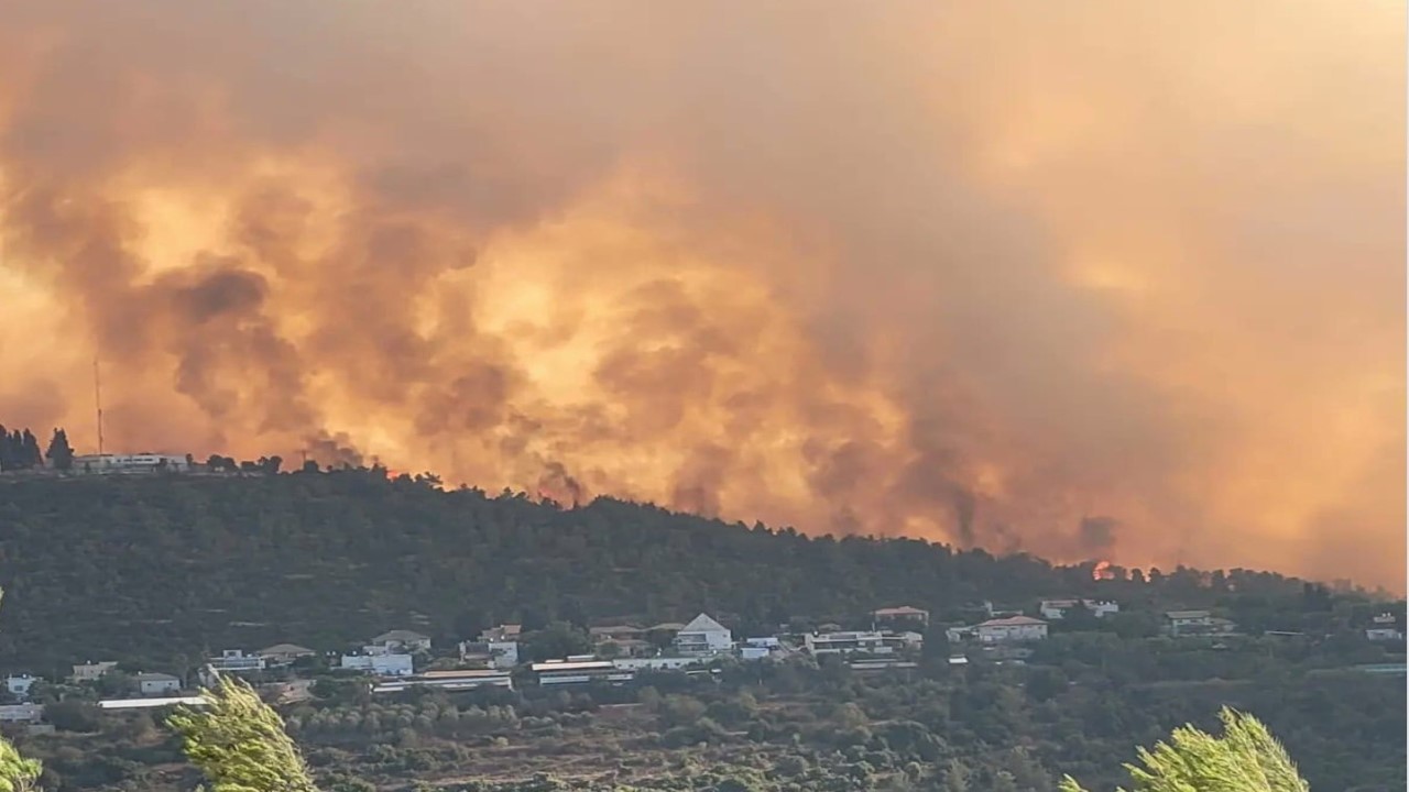 Residents evacuated as wildfire threatened homes near Israel's largest city - credit YNet News