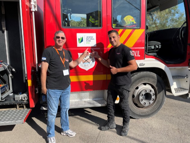 The Villages resident, Steven Lefland, proudly poses in front of an Israeli fire truck donated by Jewish National Fund-USA