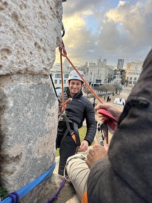 man rock climbing